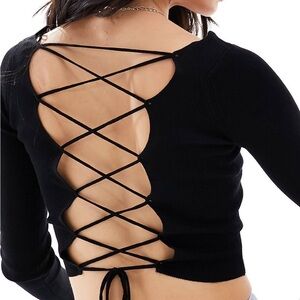 Pull&Bear adjustable strappy back crop long sleeved top in black.